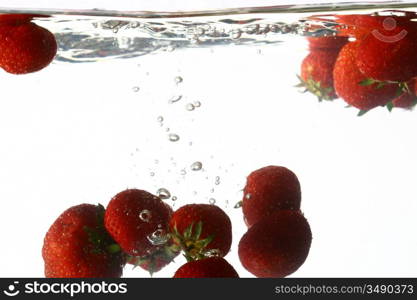 strawberry splash in water isolated on white background