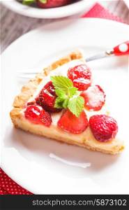 Strawberry tart with custard on the table. Strawberry tart