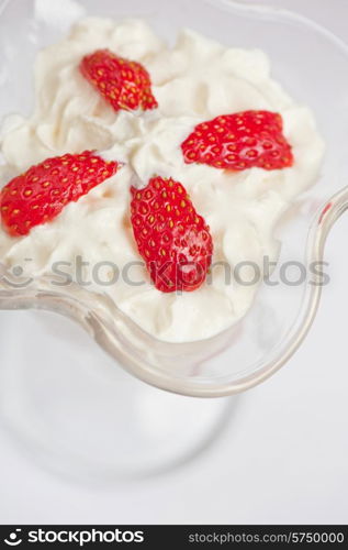 strawberry with cream closeup photo. strawberry with cream