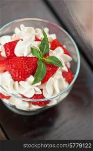 strawberry with cream closeup photo. strawberry with cream