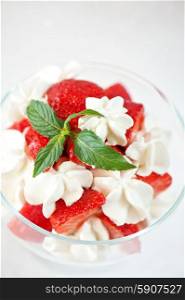 strawberry with cream. strawberry with cream closeup photo