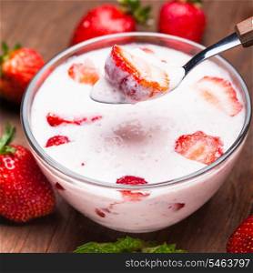 Strawberry yoghurt in a bowl on the table