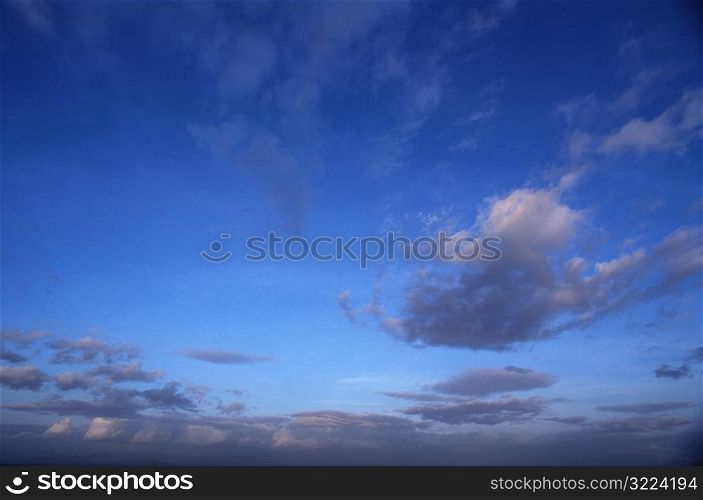 Streaking Gray Clouds In Blue Sky