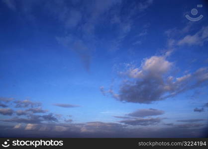 Streaking Gray Clouds In Blue Sky