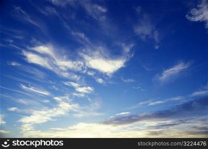 Streaking Thin Clouds In A Bright Blue Sky