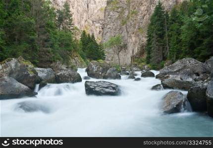 stream between rocks in Pre Saint Didier, Aosta. Italy