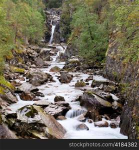 Stream flowing through rocks, E16, Norway