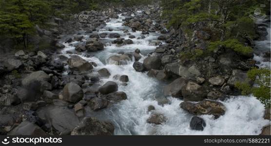 Stream flowing through rocks, French River, French Valley, Torres Del Paine National Park, Patagonia, Chile