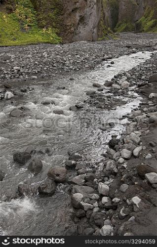 Stream in rugged ravine in Iceland
