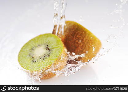 stream of cold water flows on fruits and splashes