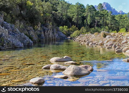 Stream, rocks, trees and Mountains at Col de Bavella, Corsica