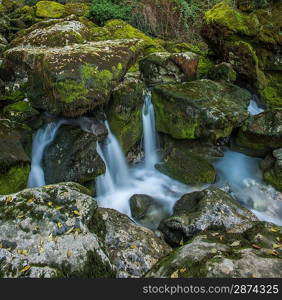 Stream running between rocks in Fontaine-de-Vaucluse, France