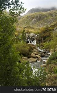 Stream tumbling down from Lake Idwal, Ogwen Cottage, the Nant Ffrancon Valley, Gwynedd, Wales, United Kingdom