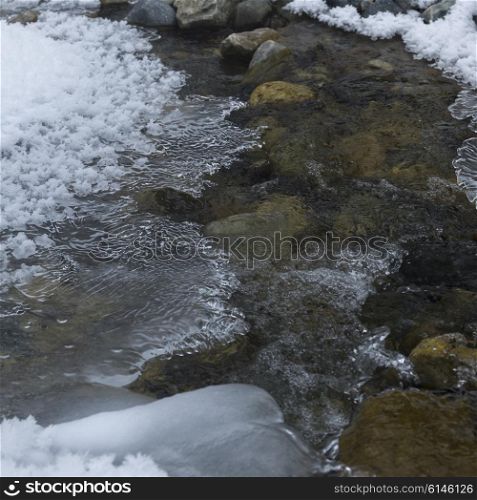 Stream with snow, Lake Louise, Banff National Park, Alberta, Canada