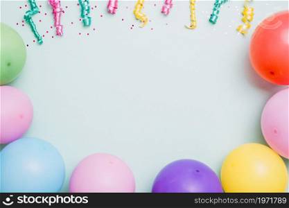 streamers colorful balloons blue backdrop space text. High resolution photo. streamers colorful balloons blue backdrop space text. High quality photo