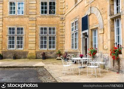 Street cafe in ancient European tourist city. Summer tourism and travels, famous europe landmark, popular places for travelling