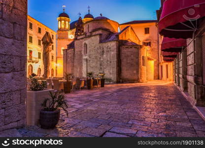 Street cafe near Saint Nicholas church in Kotor. Cafe near church