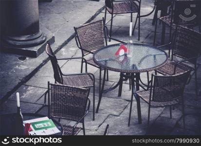 Street cafe terrace with table and chairs in European city