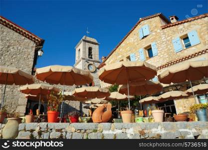 Street cafe with umbrellas in the village France