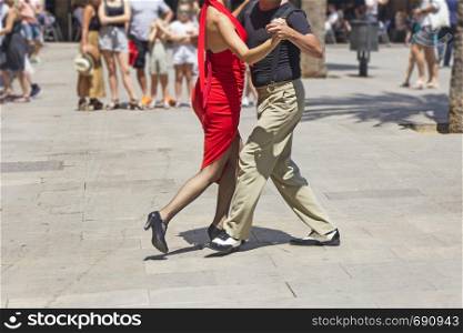 Street couple dancers performing Argentine tango dance