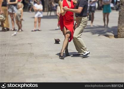 Street couple dancers performing Argentine tango dance