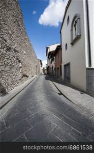 Street in a old city without people and cars in Italy. Narrow street in the medieval italian town.