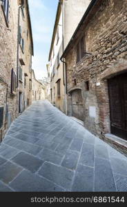 Street in a old city without people and cars in Italy. Narrow street in the medieval italian town.