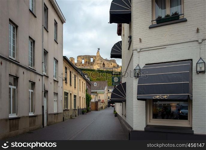 Street in medieval town of Valkenburg, The Netherlands during a cloudy day in summer