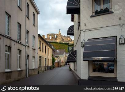 Street in medieval town of Valkenburg, The Netherlands during a cloudy day in summer
