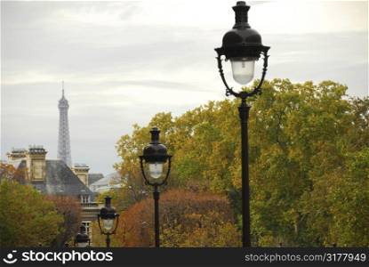 Street in Paris France with lightposts on overcast autumn day
