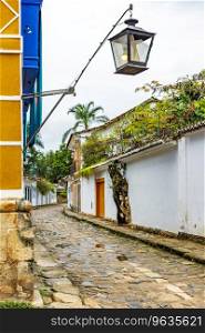 Street in the old city of Paraty on the coast of Rio de Janeiro with its colonial-style houses and cobblestone streets. Street in the old city of Paraty on the coast of Rio de Janeiro