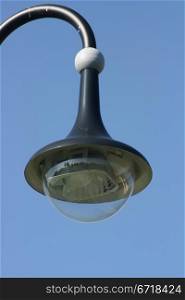 Street lamp with a large screen, blue sky in the background