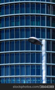 Street Lamp with a Modern Building Facade at Background