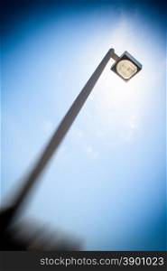 street light alternative energy. Street light that hide the sun. Metaphor of alternative energy and solar energy