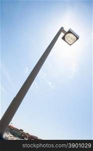 street light alternative energy. Street light that hide the sun. Metaphor of alternative energy and solar energy