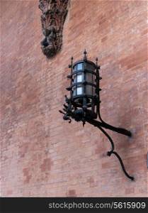 Street light on a palace of the merchandise Bologna italy