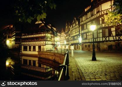 Street lights illuminated during night in Old Town, Strasbourg, France