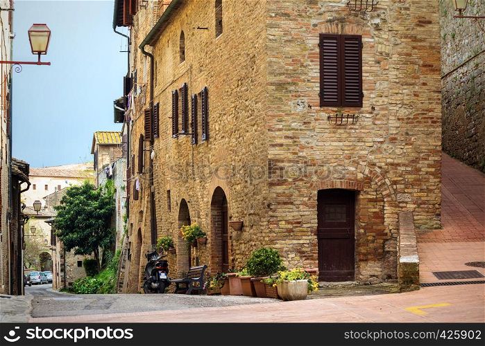 street old town San Gimignano at the province of Siena. Tuscany, Italy