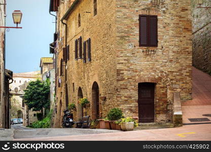 street old town San Gimignano at the province of Siena. Tuscany, Italy