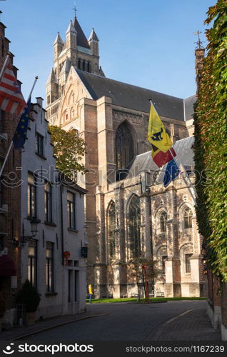 Street onto the cathedral, historic city of Bruges, Belgium
