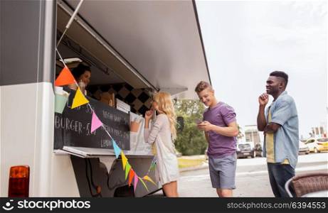 street sale and people concept - happy customers queue at food truck. happy customers queue at food truck