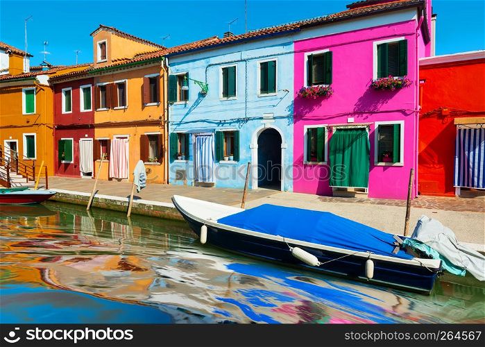 Street with colorful houses on Burano in summer