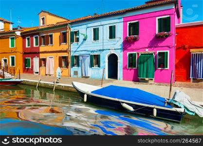 Street with colorful houses on Burano in summer