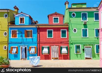 Street with colorful old houses in Burano island in Venice, Italy -- Italian cityscape