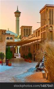 Street with mosque in Al Fahidi Historical Neighbourhood in Old Dubai in the evening, United Arab Emirates
