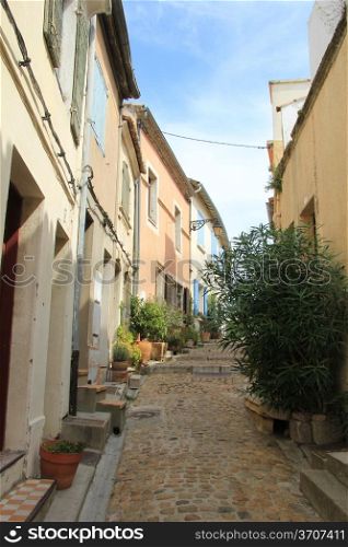Street with old houses in Arles, Provence