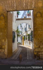 Streets decorated with bows and barred windows typical of the city of Cordoba, Spain