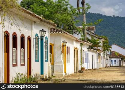 Streets of cobblestone and old houses in colonial style on the streets of the old and historic city of Paraty founded in the 17th century on the coast of the state of Rio de Janeiro, Brazil. Streets of cobblestone and old houses in colonial style on the historic city of Paraty