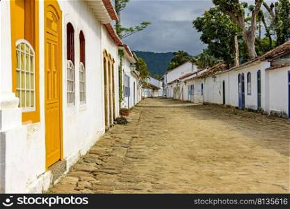 Streets of cobblestone and old houses in colonial style on the streets of the old and historic city of Paraty founded in the 17th century on the coast of the state of Rio de Janeiro, Brazil. Cobblestone streets and old houses in colonial style on the old and historic city of Paraty