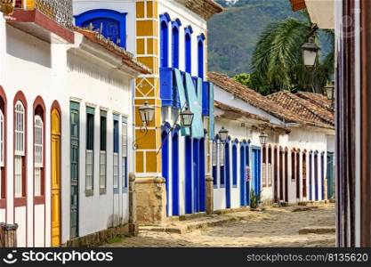 Streets of cobblestone and old houses in colonial style on the streets of the old and historic city of Paraty founded in the 17th century on the coast of the state of Rio de Janeiro, Brazil. Streets of cobblestone and old houses in colonial style on the old and historic city of Paraty